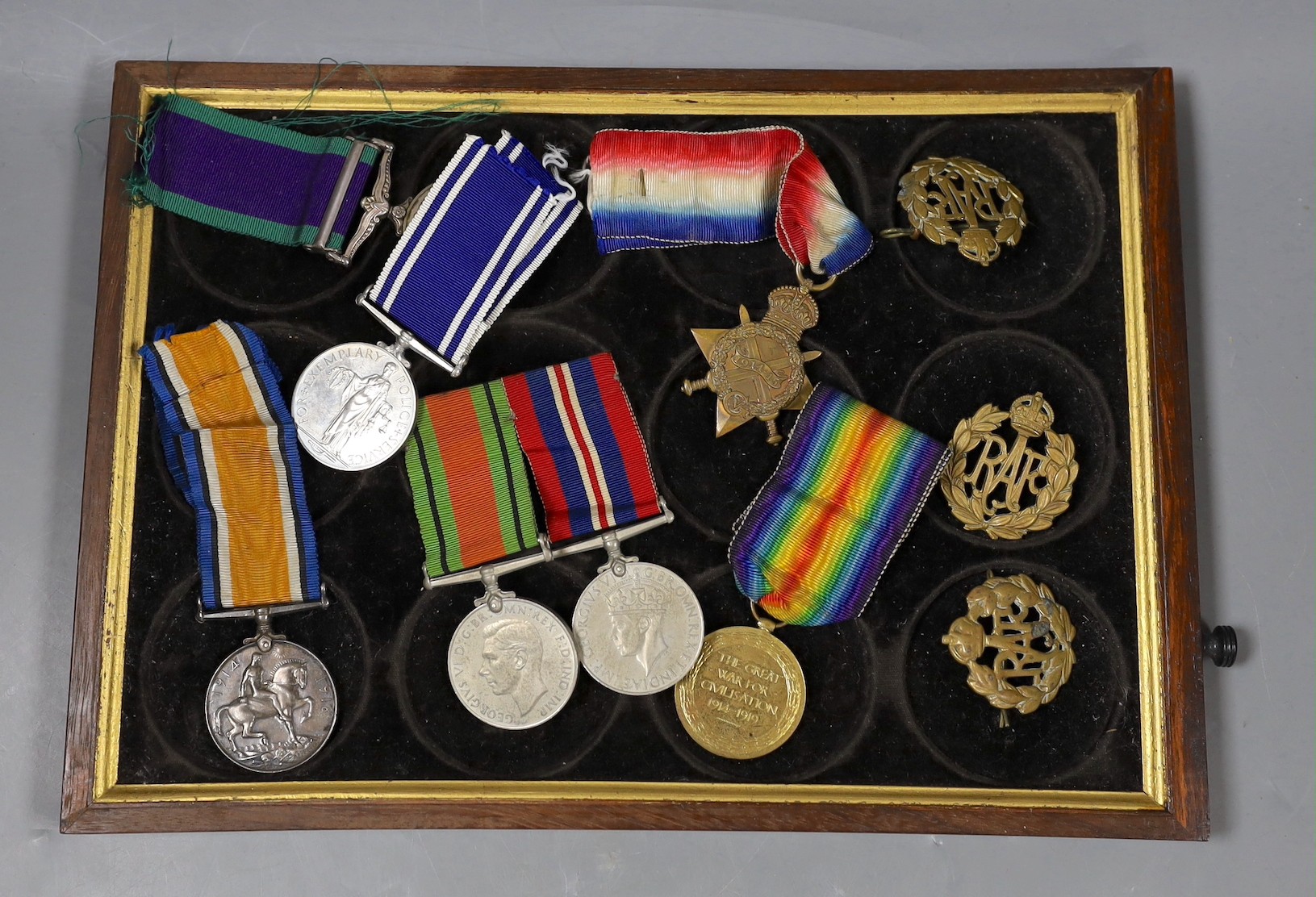 A WWI to Elizabeth II family medal group including WWI trio GSM with Borneo clasp, QEII Police medal etc
